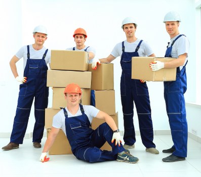 Moving team handling furniture safely during a Bethnal Green van service