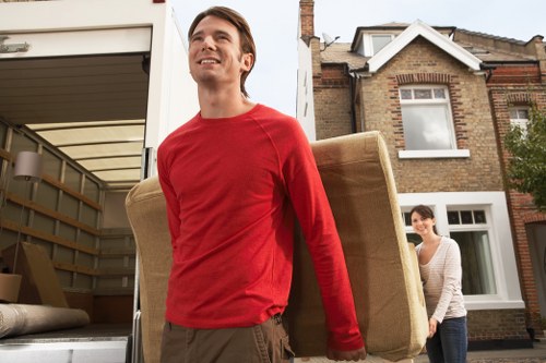 Professional movers handling boxes during a Bethnal Green flat move