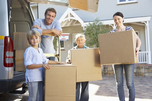 Moving team handling furniture during a house removal in Bethnal Green