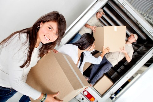 Packing and loading furniture into a removals van
