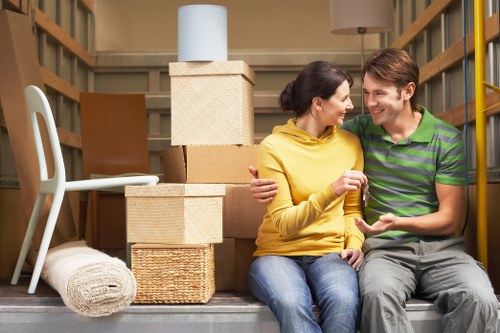 Packed moving boxes and furniture ready for local transport